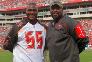 Bucs legends Derrick Brooks & Warren Sapp - Photo by: Cliff Welch/PR