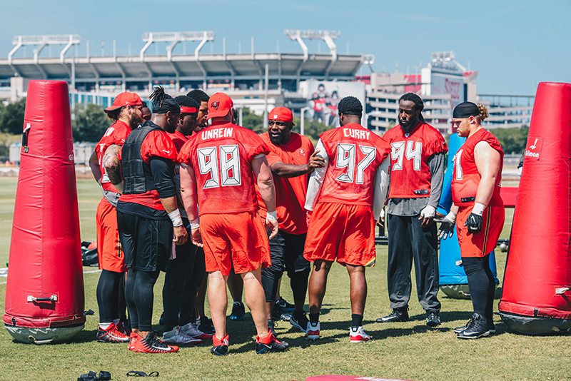 Bucs D-Line Coach Brentson Buckner And His Players - Photo Courtesy Of The Buccaneers