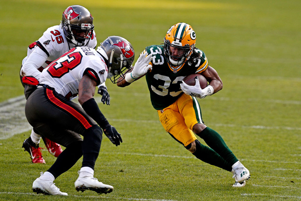 Bucs Ss Jordan Whitehead And Packers Rb Aaron Jones