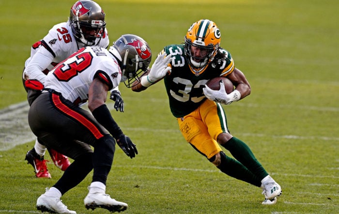 Bucs Ss Jordan Whitehead And Packers Rb Aaron Jones