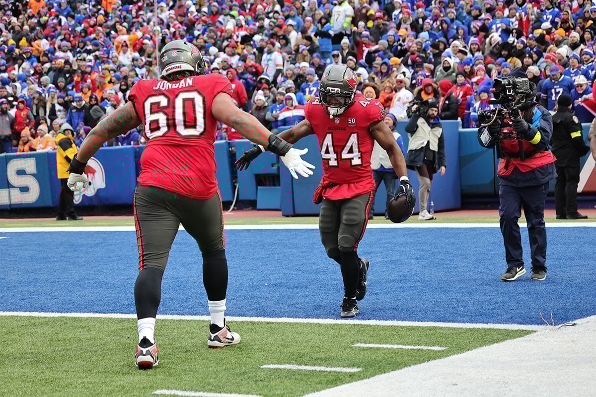 Tucker-Sean-Mike-Jordan-Bucs-Bills-Td-Celebrate Bucs Rb Sean Tucker And Lg Mike Jordan