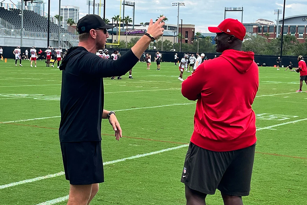 Bowles-Todd-Liam-Coen-Bucs-Jaguars-Joint-Practice-Discuss Jaguars Hc Liam Coen And Bucs Hc Todd Bowles